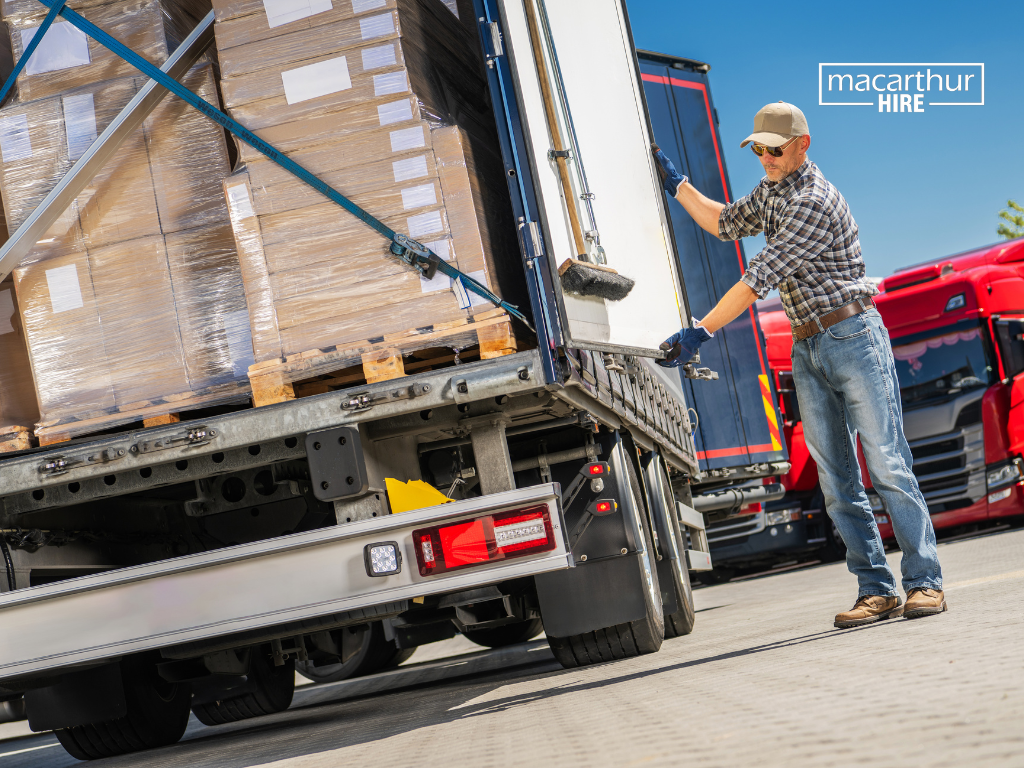 Furniture, boxes and equipment organised beside a hire truck before loading, showing the importance of planning the load sequence.